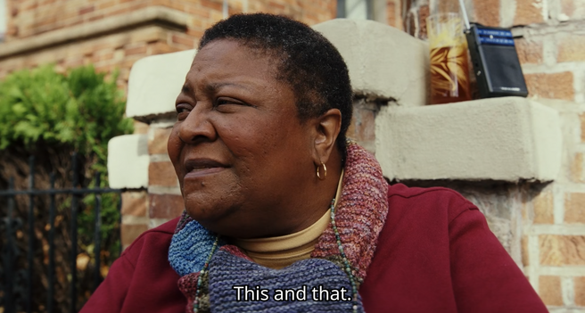 Back the Black woman, who shrugs and says, "Eh. This and that."